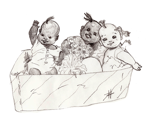 bonecas Duas bonecas negras e uma boneca branca dentro de uma caixa de papelão.